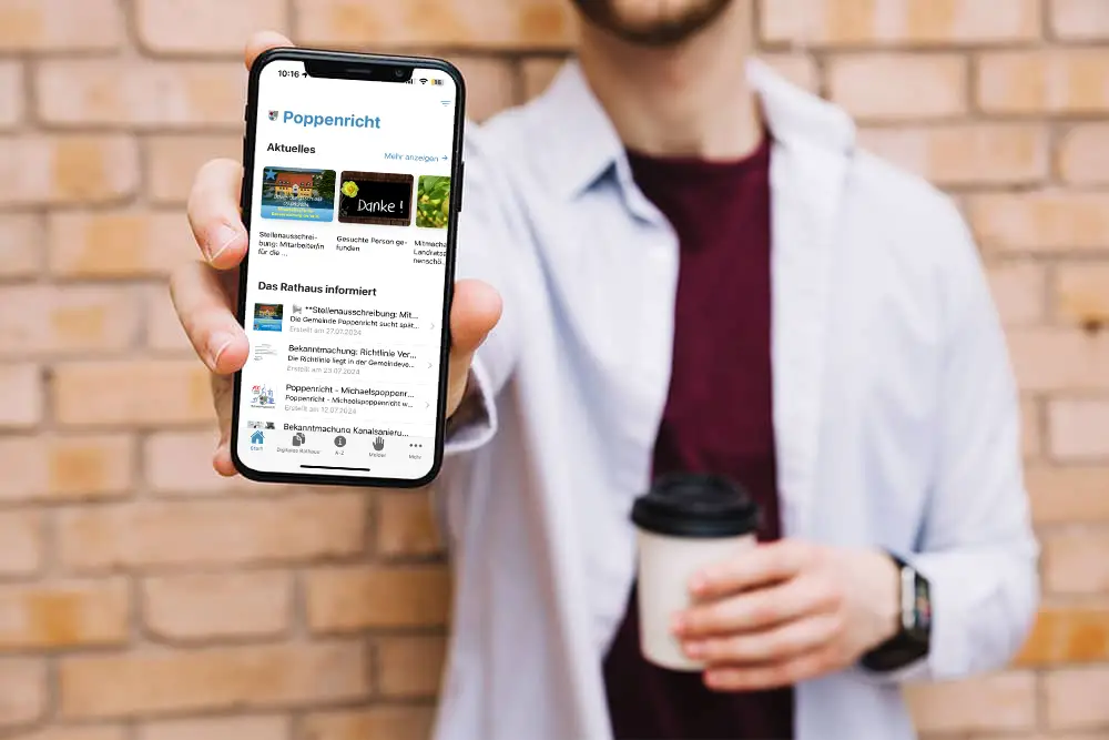 man-holding-iphone-x-mockup1